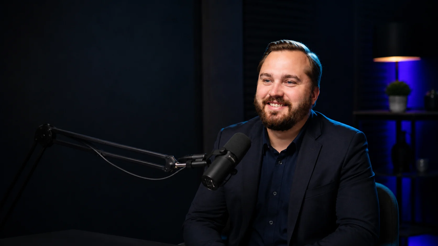 Ben Langner recording a podcast in a studio